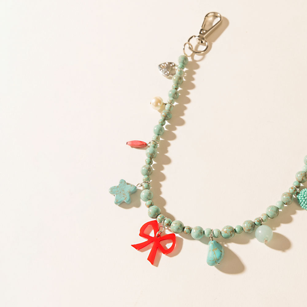 Nina’s Lucky Bag Charm in Ocean Blue