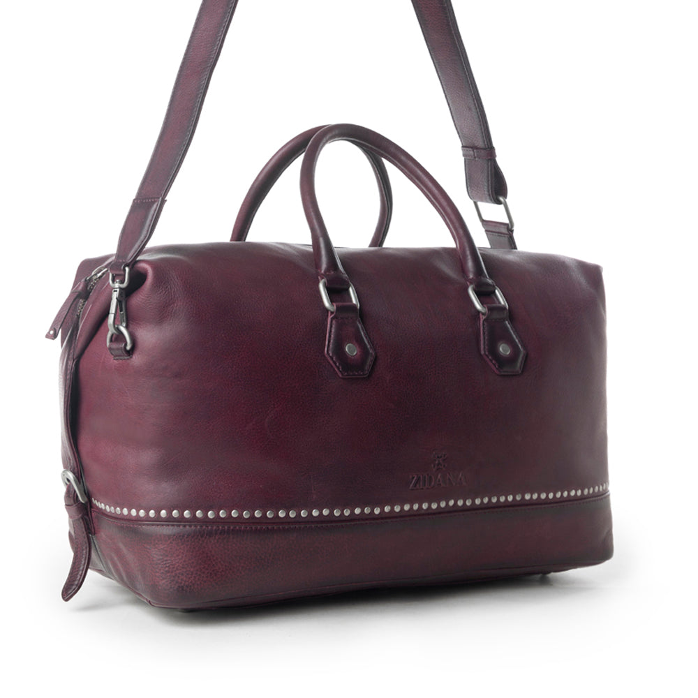 Myra Zidana Sundown Plains Veg Tanned Leather Traveller Bag in Dusty Berry